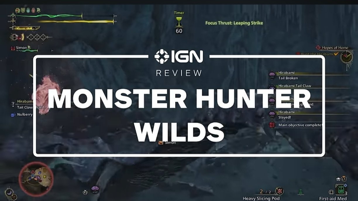 IGN review screen for Monster Hunter Wilds, showing in-game footage of a completed hunt with player HUD elements and quest completion notifications.